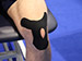 Tiger K Tape being applied to knee