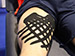 Tiger K Tape being applied to hamstring